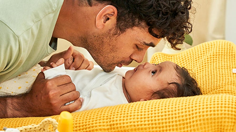Father kissing baby