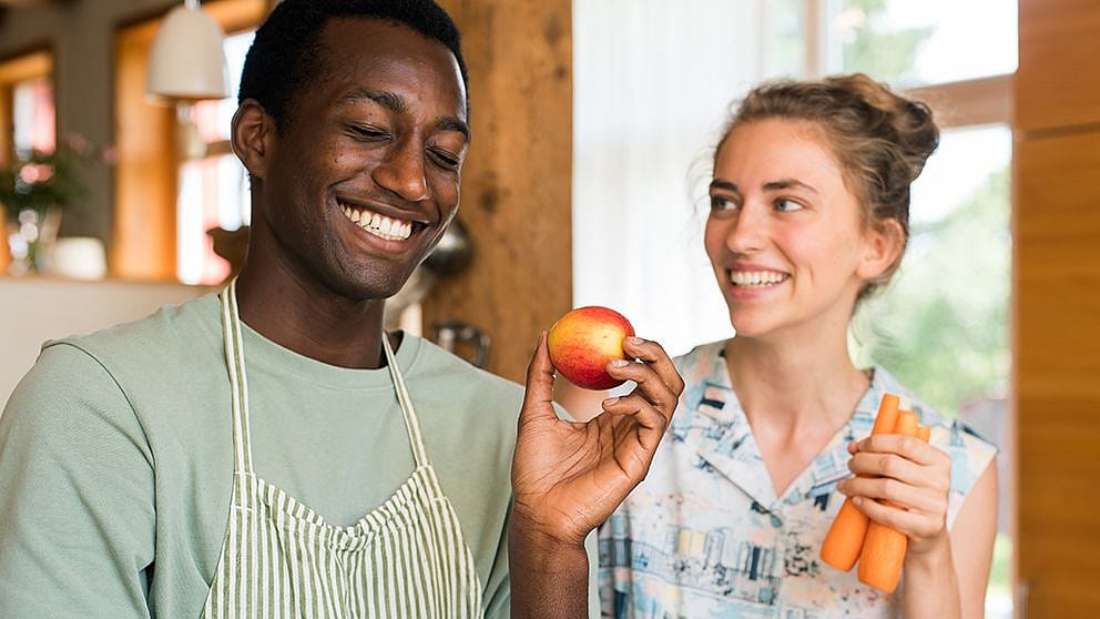 Woman and man in kitchen.