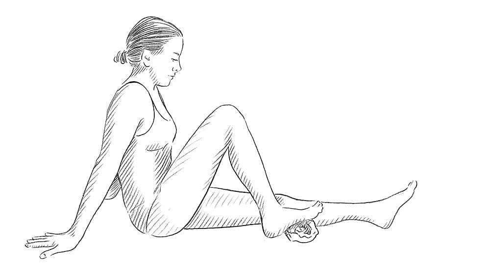 Drawing of a person seated on the floor with a towel under their right foot