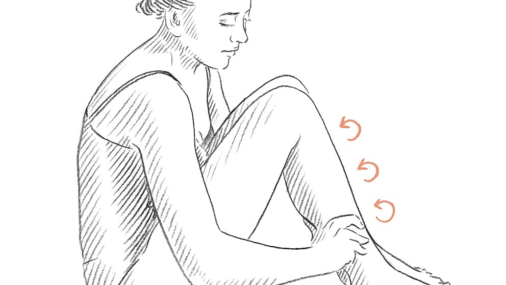 Drawing of a person seated on the floor massaging their leg in circular motions