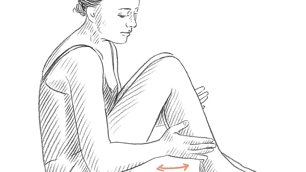 Drawing of a person seated on the floor massaging their leg with light strokes