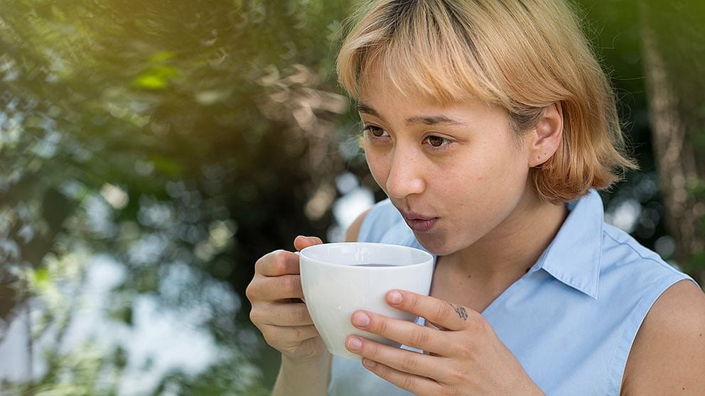 Woman drinking tea.