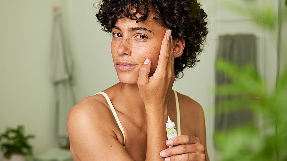 Woman applying Blemished Skin S.O.S. Spot Treatment onto her face