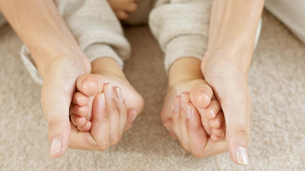 massaging baby feet